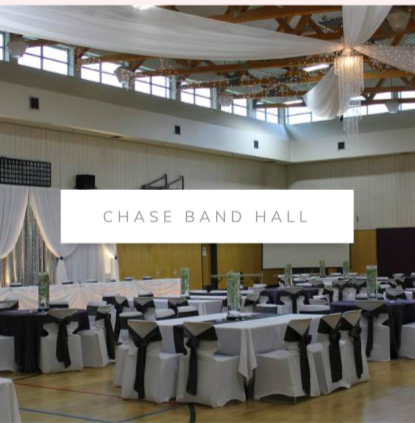 Chase band hall wedding setup, ceiling drapery, head table, backdrop and chair covers