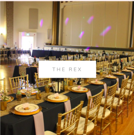 Wedding decor at The Rex. wedding decor. Gold chiavari chairs, navy table cloths, head table lighting